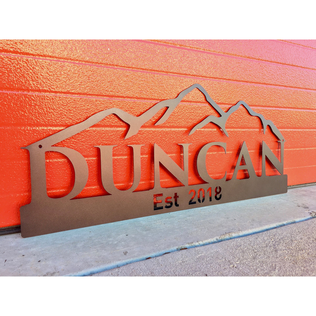 Custom Name sign with mountains on red background